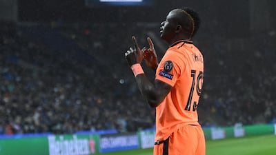 Liverpool's Senegalese midfielder Sadio Mane celebrates after scoring their third goal. Francisco Leong / AFP
