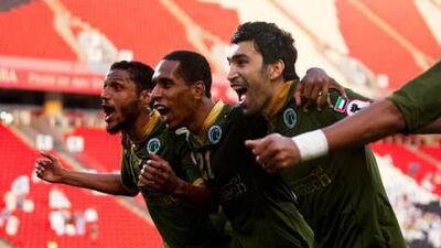 Adel Abdullah, centre, celebrates with his Al Shabab teammates after scoring in the 4-0 rout of Al Jazira.