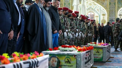 Mourners attend the funeral of Kataib Hezbollah members who were killed in US air strikes, in Najaf, Iraq. AP