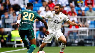 Real Madrid's Dani Carvajal in action with Real Betis' Junior Firpo. Reuters