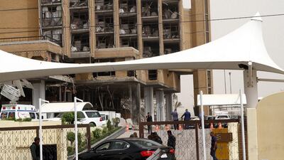 Iraqi policemen stand guard in the entrance of Babylon hotel. Ali Abbas / EPA