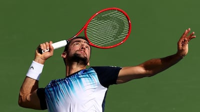 Marin Cilic serves against Benoit Paire. Getty