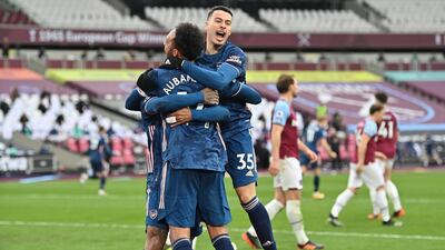 Arsenal players celebrate their equaliser against West Ham United. EPA