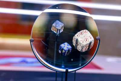 A 1,000-year-old six-sided dice from Iran show how the game piece has changed remarkably little over the centuries. Victor Besa / The National