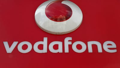A branded sign is displayed on a Vodafone store in London. Reuters