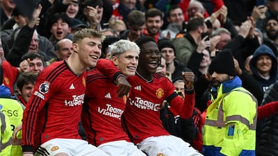 Manchester United's Alejandro Garnacho, centre, celebrates after scoring his team's second goal against West Ham United with Rasmus Hojlund and Kobbie Mainoo in the Premier League game at Old Trafford on February 4, 2024. AFP