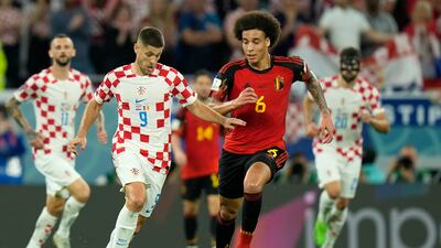 Croatia's Andrej Kramaric, left, duels for the ball with Belgium's Axel Witsel. AP