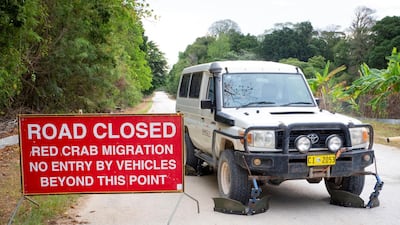 A Toyota Land Cruiser is pictured with deflectors, created by an eco-lodge owner, that allow it to drive slowly along a road that is usually closed for red crabs conducting their annual migration on Christmas Island, Australia. Chris Bray/Swell Lodge - Christmas Island via Reuters