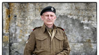 Jonas Oxnard, from Sweden, wears a replica uniform of member of the British Army 5th Royal Tank Regiment.