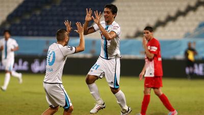 Mohammed Jaber, No 21, and Baniyas moved into second place in Group A of the League Cup with a 3-1 defeat of Al Jazira on Wednesday. Pawan Singh / The National