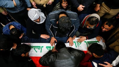 Mourners gather near the coffin of a man, who was killed in a twin suicide bombing attack in a central Baghdad market, during a funeral in Najaf, Iraq. Reuters