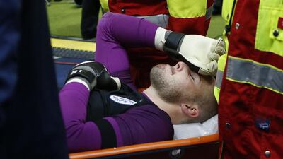 England’s Jack Butland looks dejected as he is stretchered off after sustaining an injury. Reuters / Fabrizio Bensch