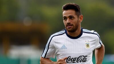 Argentina’s Lautaro Acosta jogs during a training session ahead of their match against Chile. REUTERS/Enrique Marcarian