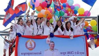 Supporters of the Cambodian People's Party (CPP) gesture during a general election campaign in Phnom Penh. AFP