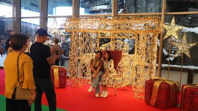 Visitors get Christmas photos at Mall of the Emirates in Dubai. Pawan Singh / The National