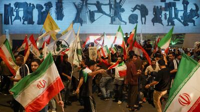 People in Baghdad celebrated a perceived Iranian victory after US President Donald Trump announced a ceasefire. Reuters