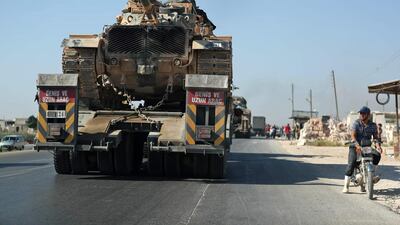 The convoy passes through the town of Saraqeb in the northwestern province of Idlib. AFP