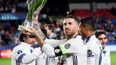 Real Madrid's Sergio Ramos celebrates with the trophy after winning the Uefa Super Cup on Tuesday night. Jonathan Nackstrand / AFP / August 9, 2016