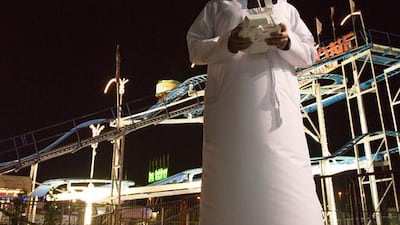 Ahmad Almarri demonstrates the precision take off and landing of the Phantom 2 quadcopter camera drone that Global Village uses for security purposes. Duncan Chard for the National