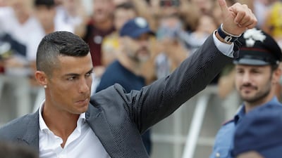 Portuguese ace Ronaldo salutes his fans as he arrives to undergo medical checks at the Juventus stadium in Turin, Italy, on July 16, 2018. AP Photo