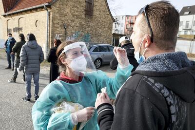 A laboratory assistant takes a sample for a coronavirus test in Flensburg, Germany. Getty Images