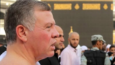 King Abdullah II stands near the Kaaba. Yousef Allan / Jordanian Royal Palace / AFP Photo