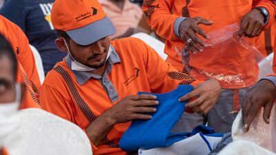 Workers receive gifts and food parcels.