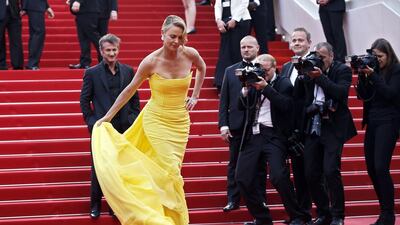 Charlize Theron in Dior Couture and Sean Penn. AFP