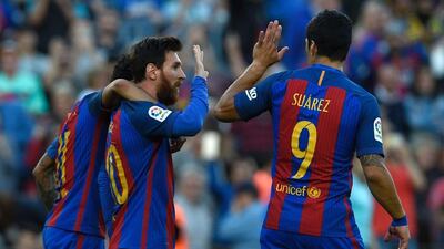All three of Barcelona's front three – Neymar, left, Lionel Messi, centre, and Luis Suarez – scored in the win over Villarreal. Lluis Gene / AFP