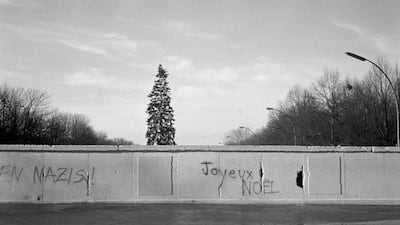 A Christmas tree seen across the Berlin Wall from the East on December 26, 1989 in Berlin, Germany. August 13th 2011 will mark 50 Years Since East German Troops Sealed The Border Between East And West Berlin. (File Photo by Steve Eason/Hulton Archive/Get???