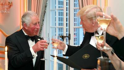 President Donald Trump and the Prince of Wales raise their glasses in a toast at the Return Dinner at Winfield House, the residence of the US Ambassador to the UK, in Regent's Park in London. AP