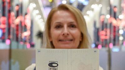 A woman shows off her new stamp.