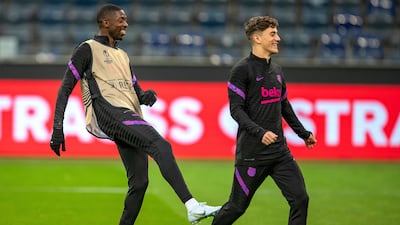 FC Barcelona players Ousmane Dembele (L) and Pedri (R) attend their team's training session in Frankfurt am Main, Germany, 06 April 2022. FC Barcelona will face Eintracht Frankfurt in their UEFA Europa League quarter final, first leg soccer match on 07 April 2022. EPA / CONSTANTIN ZINN