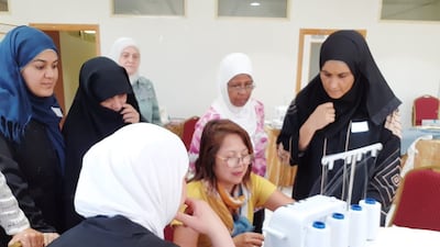 Carla Bygrave, centre, is co-founder of Skills3, an organisation seeking to equip women from disadvantaged backgrounds with new skills and opportunities. Photo: UNHCR