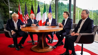Britain's Prime Minister Boris Johnson, US President Joe Biden, German Chancellor Olaf Scholz, France's President Emmanuel Macron and Italian Prime Minister Mario Draghi chat before their meeting at Elmau Castle on Tuesday morning. Getty Images