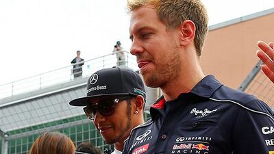 Lewis Hamilton, left, is fourth in the Divers' Championship standings with 161 points, 111 points behind leader Sebastien Vettel, right. Srdjan Suki / EPA