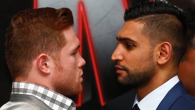 Amir Khan and Canelo Alvarez go face to face during a press conference to preview their fight in May on Monday in London. Julian Finney / Getty Images / February 29, 2016