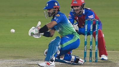 Multan Sultans' captain Mohammad Rizwan (L) plays a shot during the Pakistan Super League (PSL) Twenty20 cricket match between Karachi Kings and Multan Sultans at the National Cricket Stadium in Karachi on January 27, 2022. (Photo by Asif HASSAN / AFP)