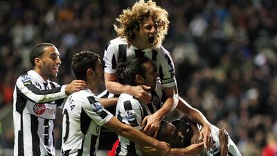 Newcastle United's Sammy Ameobi celebrates his goal against West Bromwich Albion with teammates at St James' Park. Scott Heppell/AP