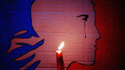 A candle burns in front of a Marianne with a tear during a vigil in Aotea Square, Auckland, New Zealand, on Novemebr 14, 2015, to remember the victims of the Paris attacks. Hannah Peters/Getty Images
