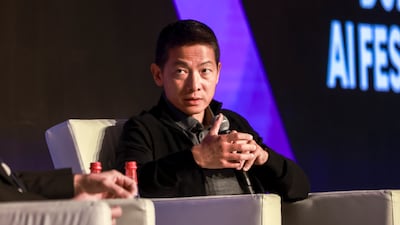 Peng Xiao, group chief executive of G42, during a panel discussion at the Dubai AI Festival on Monday. Victor Besa / The National