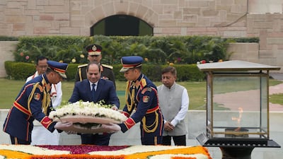 Mr El Sisi places a wreath at the Mahatma Gandhi memorial at Rajghat. AFP