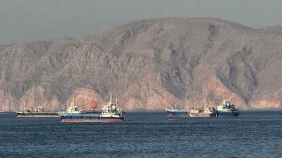 (FILES) Vessels are seen anchored in the Strait of Hormuz, off the port city of Khasab on Oman’s northern Musandam Peninsula on May 17, 2026. For 115 days, captain Mohammad Shafiqul Islam was stranded in the high seas of the Gulf, watching missiles light up the night sky and rationing food and water for his crew. "I tried to stay calm because I was responsible for 31 lives, a ship worth $40 million and cargo valued at $8. 2 million," the 51-year-old Bangladeshi mariner told AFP, back home after the ordeal. (Photo by AFP) /