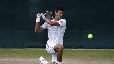 Novak Djokovic on the Wimbledon practice courts ahead of the start of the tournament on Monday. Justin Tallis / AFP / June 28, 2015