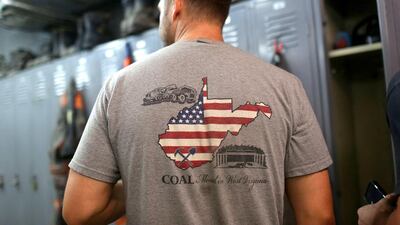 A coal miner wears a T-shirt prior to the start of his afternoon shift at a coal mine near Gilbert, West Virginia. Robert Galbraith / Reuters