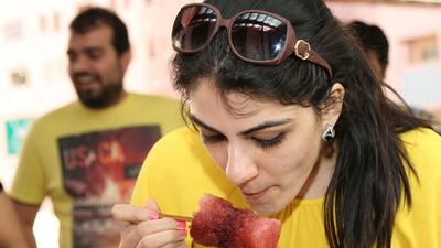 Various scenes from previous Rush-a-Way races include participants eating a snow cone. Courtesy of Rush-a-Way