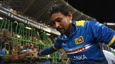 Sri Lanka's Tillakaratne Dilshan acknowledges the crowd at the end of the last match of his career, played in the second Twenty20 cricket match against Australia at the R. Premadasa Cricket Stadium in Colombo on September 9, 2016. Ishara S Kodikara / AFP