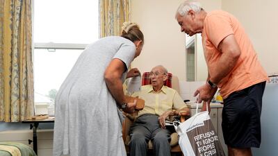 Relatives visit an elderly loved one at a care home in North Walsham, Norfolk. EPA