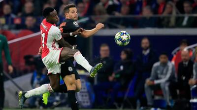 Ajax's Quincy Promes, left, vie for the ball with Chelsea's Cesar Azpilicueta. AP Photo