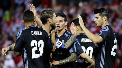Real Madrid’s Alvaro Morata, right, celebrates with his teammates. Pepe Torres / EPA